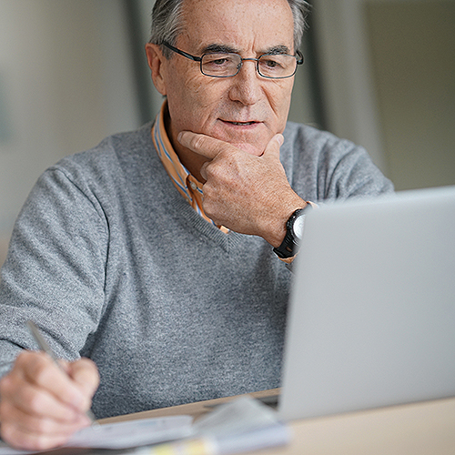 Summit Surgeons patient using Patient Portal on the computer.